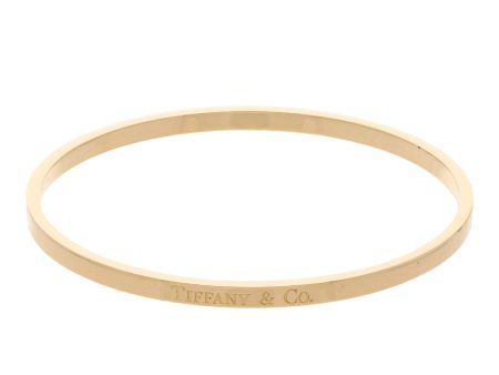 Pulsera de arillo lisa firma Tiffany & Co. en oro amarillo 18 kilates. Online Hot Sale